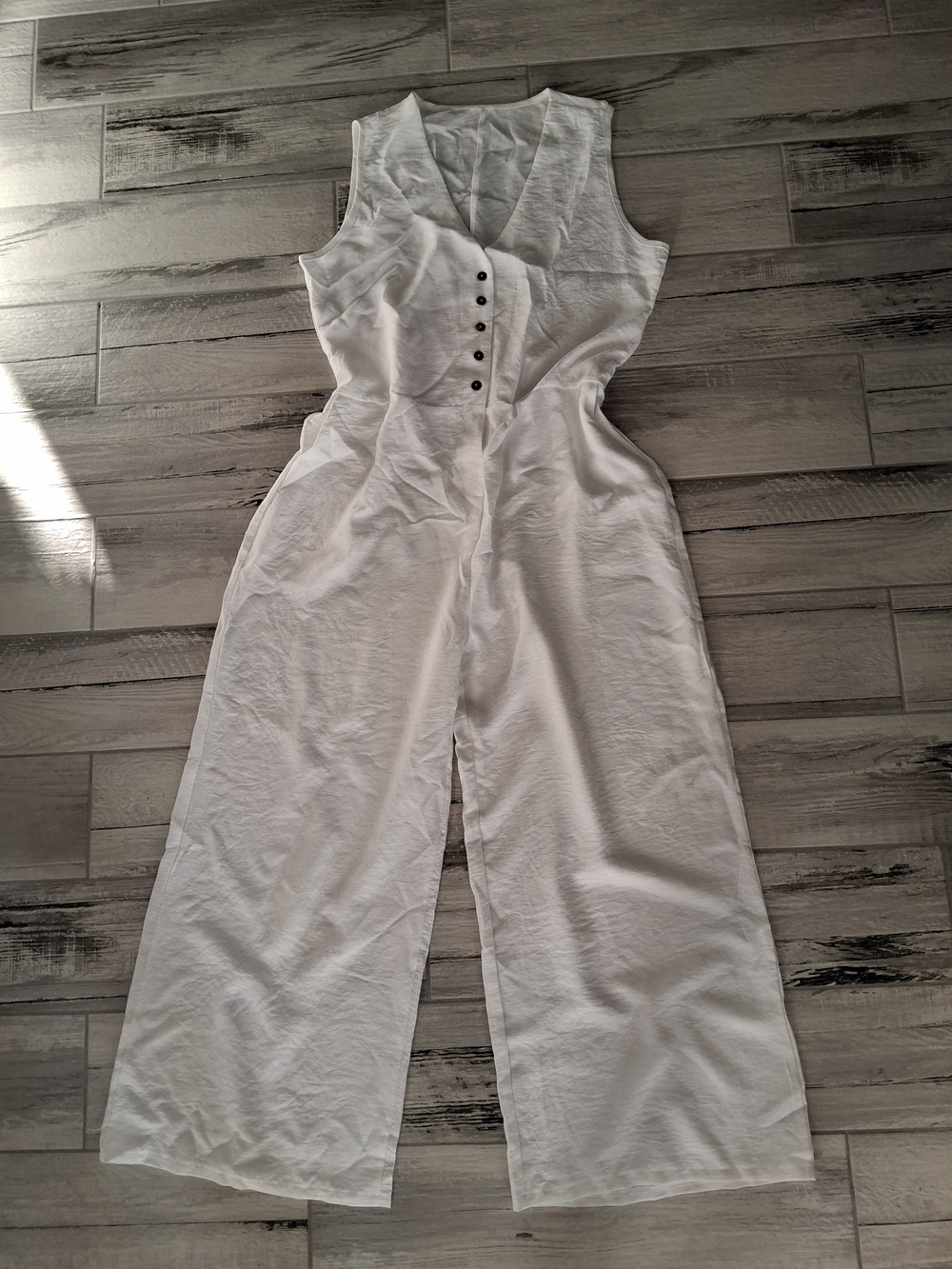Sleeveless White Wide-Leg Jumpsuit with Button Front